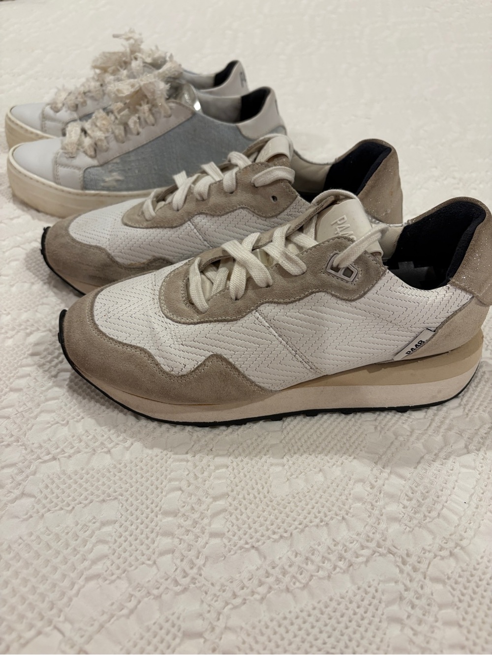 Two pairs of authentic women’s P448 luxury sneakers, both in women’s size 7 (37)
